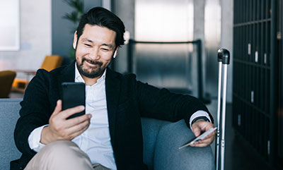  Young and happy businessman on a video call with his family