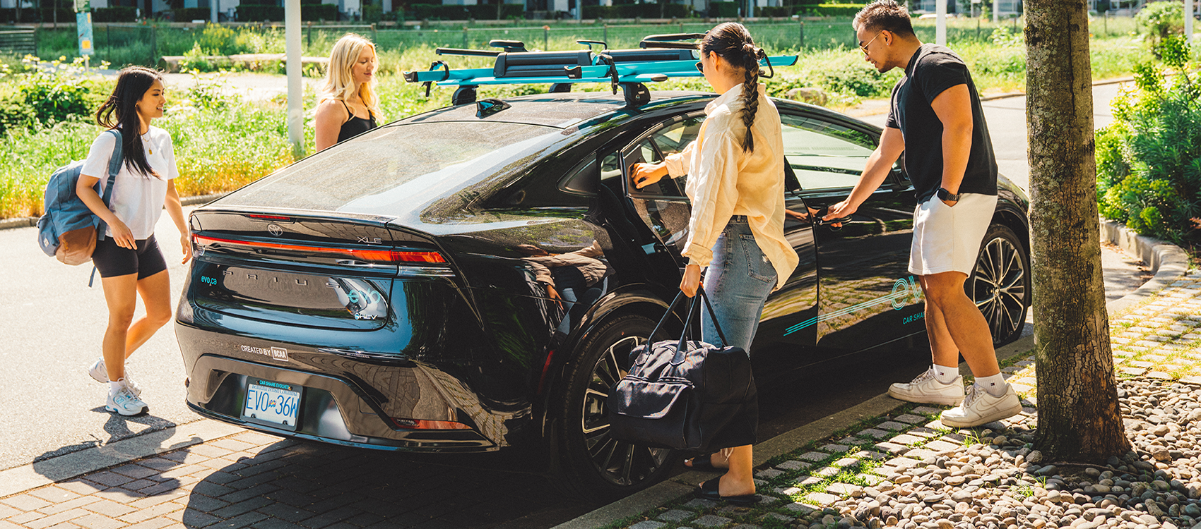 Four friends getting into an Evo