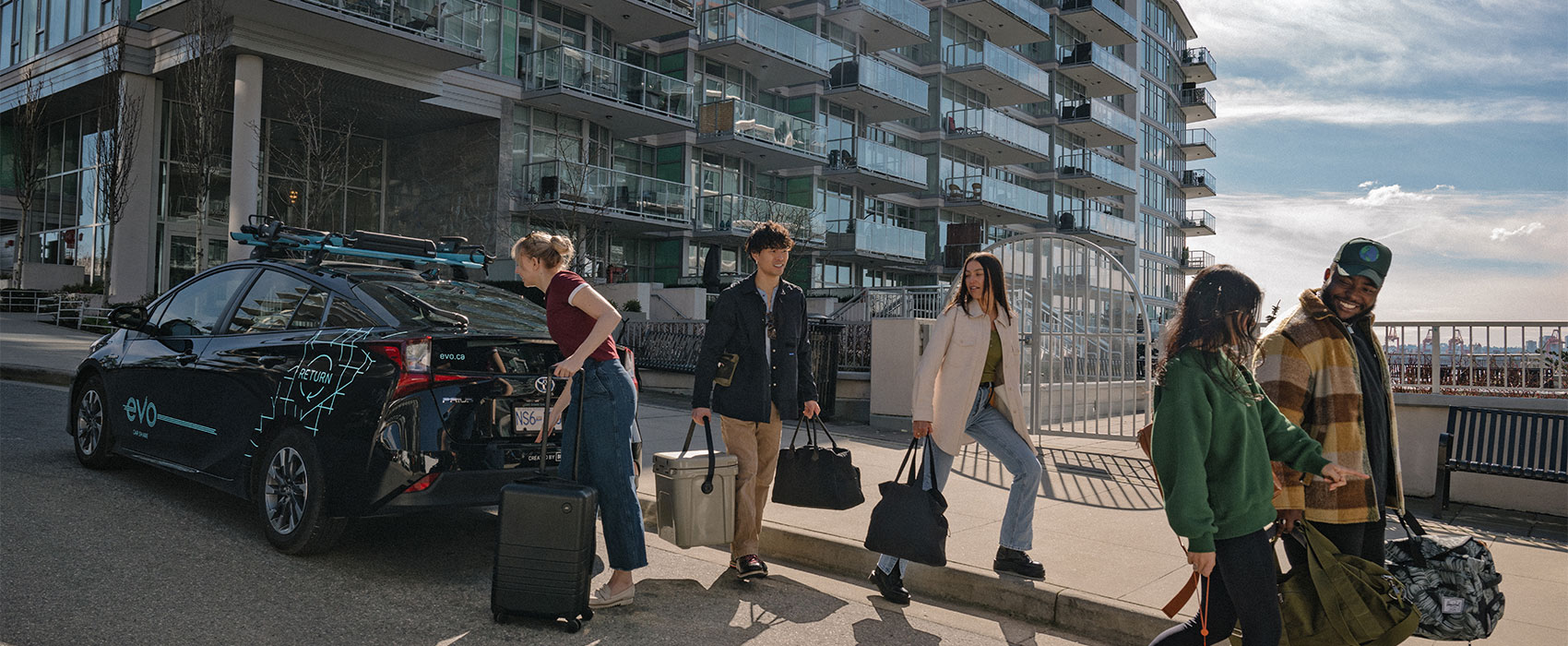 Group of friends are ready with their bags to travel in EVO car