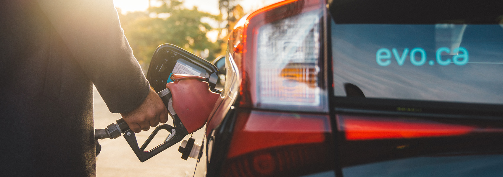 Evo being refueled at gas station